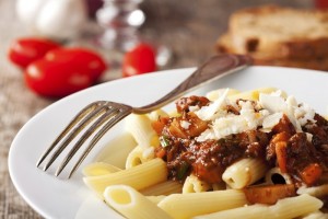 penne bolognese and parmigiano cheese
