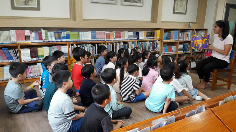 Reading to my students while teaching ESL in South Korea