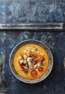 Spicy Thai soup Tom Yam with Coconut milk, Chili pepper and Seaf
