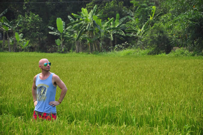 Brent standing in rice fields near Hue