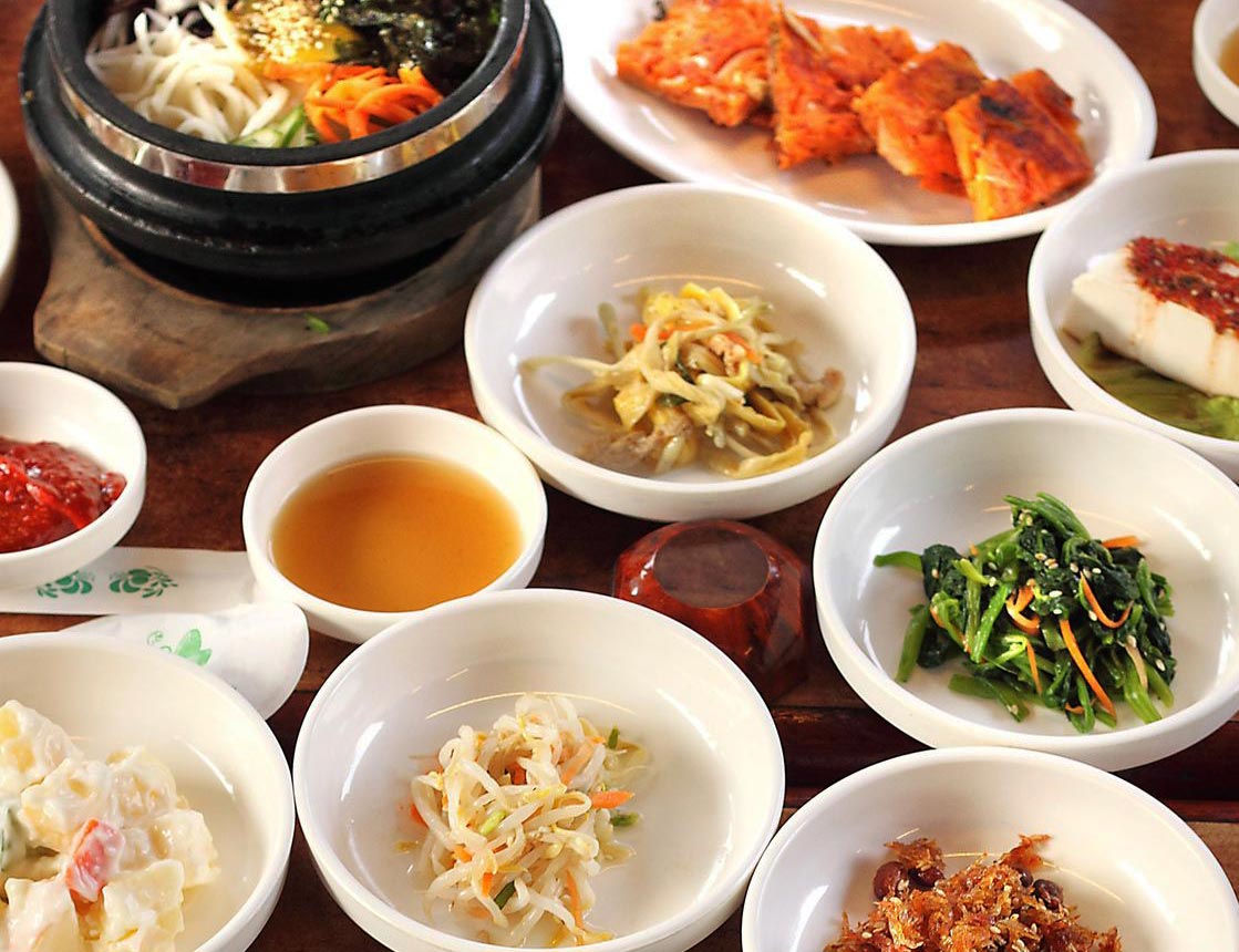 Numerous Dishes filled with a variety of South Korean cuisine